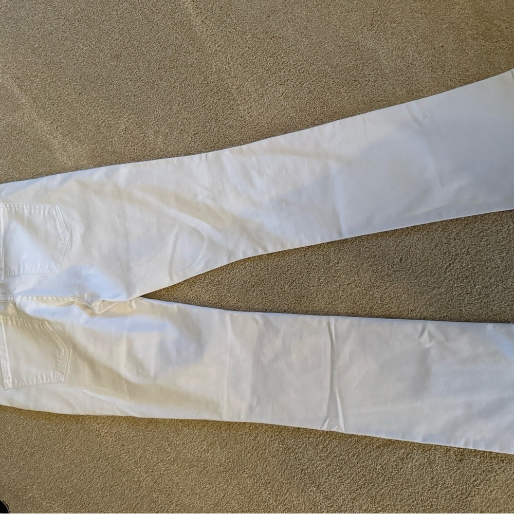 Kut from the Kloth “Natalie” bootcut jeans. “Optic white” (pure white)
